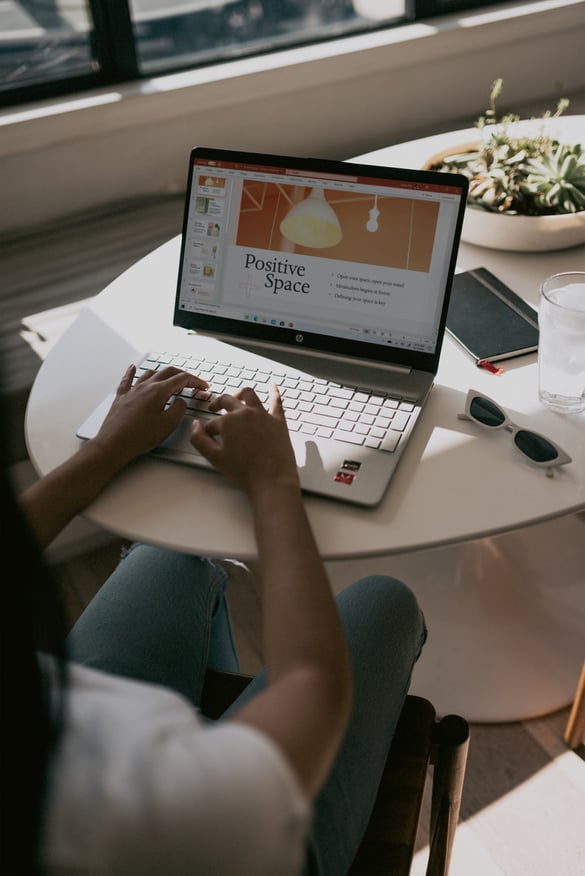 A woman working remotely on a presentation about redesigning the buyer journey to help engagement rise