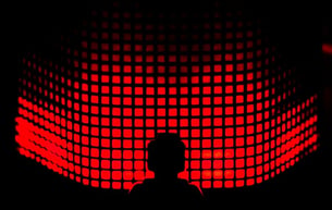 Person standing in front of LED lighting which resembles sound