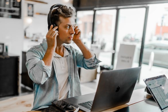 man-standing-desk-laptop-flip