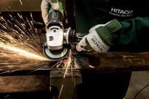Manufacturing worker using a grinder which resembles crafstmanship hubspot